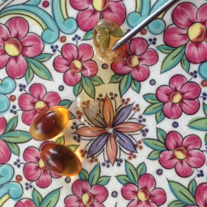 Pierce the vitamin E capsules and use the oil inside